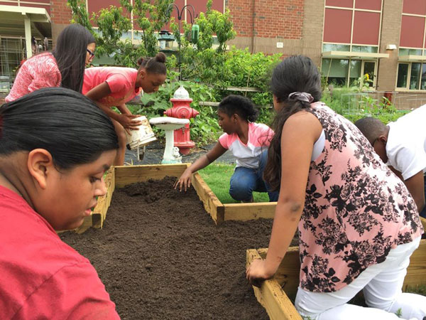 Students at Catawba Trail Elementary School prepare a new school garden for planting