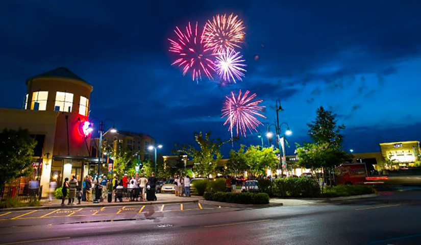 People watch a holiday fireworks display in Columbia's Sandhills area.